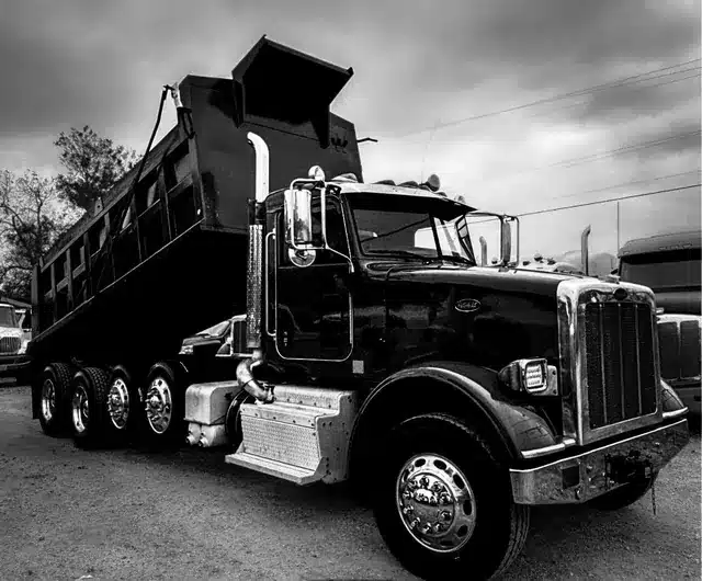 Dump truck with its raised body for aggregate hauling