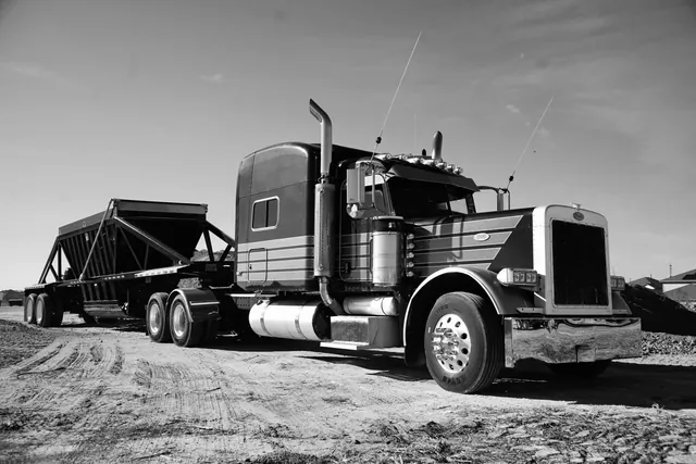 Tractor and aggregate trailer at a material yard
